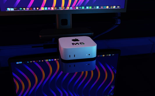 Apple mac mini computer on a desk.