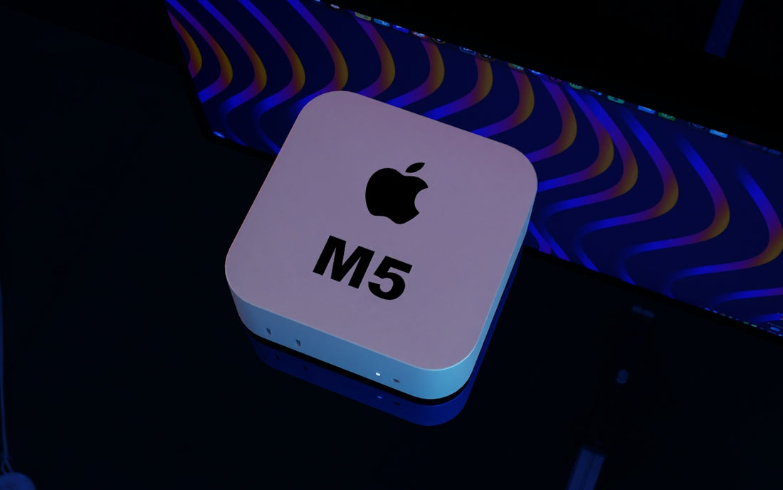 Apple mac mini m5 device on a dark surface.